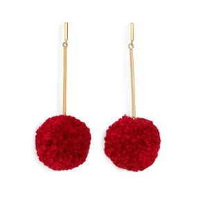 red pom pom earrings with gold hardware